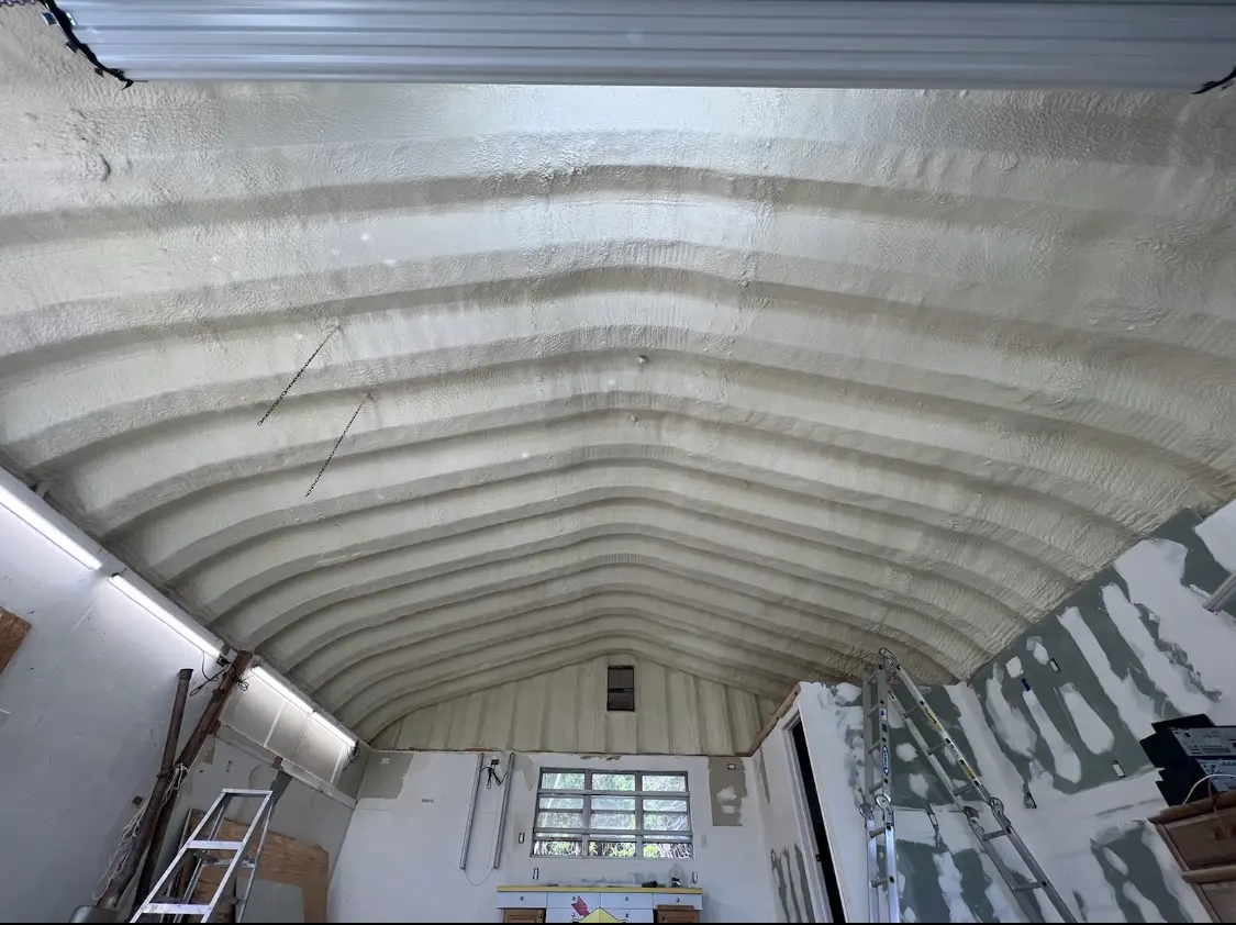 Spray polyurethane foam applied to the underside of a metal roof deck in McAlester
